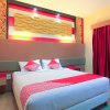 Отель Tiga Dara Kampung Wisata Hotel & Resor by OYO Rooms, фото 10