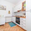 Отель Appartamento Villa da 4 Fino a 5 Persone Giardino, фото 3