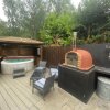 Отель Woodpecker Log Cabin with hot tub, pizza oven bbq entertainment area, lakeside with private fishing , фото 38