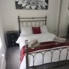 Отель Superb 1 Bedroom Stylish app 1st Fl sleeps 2 + 2, фото 5