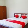 Отель OYO 1034 Pondok Mulia Guest House, фото 14