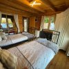 Отель Woodpecker Log Cabin with hot tub, pizza oven bbq entertainment area, lakeside with private fishing , фото 5