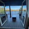 Отель Woodpecker Log Cabin with hot tub, pizza oven bbq entertainment area, lakeside with private fishing , фото 4