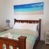 Отель At the Beach Cottages, фото 14