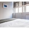 Отель Newly Refurbished 2-bedroom Flat in Shoreditch в Лондоне