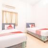 Отель OYO 863 Tenacity Guest House Syariah, фото 1