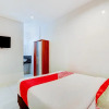 Отель OYO 90155 Landuh Merta Residence, фото 31