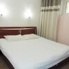 Отель Ronghe Xinya Business Hotel в Цзинани