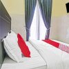 Отель OYO 90737 Losmen Aini Syariah, фото 8