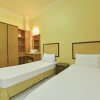 Отель OYO HOME 90700 Teluk Batik Holiday Apartment, фото 32