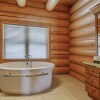 Отель Executive Plus 89 - Luxurious log Home With Private hot tub Pool Sauna and Close to Activities, фото 4