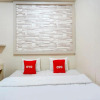 Отель SUPER OYO 90606 Glass House Citraland Syariah, фото 2