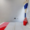 Отель OYO 92861 Raya Guest House Syariah, фото 9