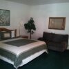 Отель Ponderosa Gardens Motel, фото 5