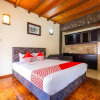 Отель OYO 2640 Rumah Kayu Cottage Syariah, фото 5