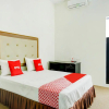 Отель OYO 3884 Dixie Syariah Guest House, фото 1