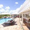 Отель Charming Tropical Villa, Walk to the Beach! AC, Pool, Free Wifi, Concierge, Ideal for Families, фото 18