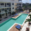 Отель Blue Luxury 1 BD Apartment - Direct exit to the Pool - Fast WiFi - Free Parking, фото 9