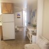 Отель Central 2 bedroom unit with 3 beds and 3 large TVs, фото 2