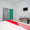 Отель OYO 754 Nur Aziziah Guest House Syariah, фото 1