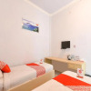 Отель OYO 1074 Homestay Rumah Puti, фото 20