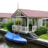 Отель Cozy Chalet Right on the Water in Friesland, фото 6
