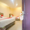 Отель OYO 184 Grand Putri Sriwijaya, фото 3