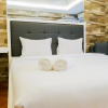Отель Minimalist Comfy Studio Apartment at Educity Pakuwon, фото 2