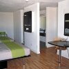 Отель Homegate Studios & Suites, фото 3