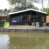 Отель Modern Chalet in a Small Park, Located Right Along a Fishing Pond, фото 1