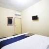Отель Tiga Mas Inn by OYO Rooms, фото 19