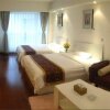 Отель Qingdao Dusco Holiday Apartment, фото 10