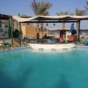 Отель Rare 2BD Marina Hotspot With Pool, Fast Free WIFI & Balcony - 2 Kitchens & 2 Bathrooms - Western Sta в Хургаде