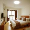 Отель Dalian Xuanyi Selected Holiday Apartment, фото 1