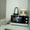 Отель Nice Studio Apartment At Aeropolis Residence Near Cgk Airport, фото 8