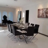 Отель Modern Waterfront Villa on Normandy Golf Course, фото 6