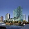 Отель Melbourne Docklands Convesso Seaview Apartment в Мельбурне