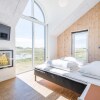 Отель 12 Person Holiday Home in Blavand, фото 10