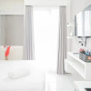Отель Elegant with Brand New at Studio Emerald Bintaro Apartment, фото 2