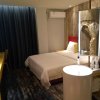 Отель Yantai 90's Light Luxury Hotel, фото 8