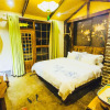 Отель Dielianhua Cowherd Inn Zhangjiajie, фото 13