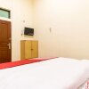 Отель Nia Mandiri by OYO Rooms, фото 22