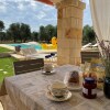 Отель Antico trullo ristrutturato con piscina e giardino, фото 17