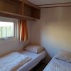 Отель Carefully Furnished Chalet With Microwave, at the Wadden Sea, фото 2