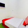 Отель OYO 90725 Zeevanna Guest House Syariah, фото 2