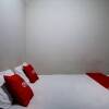 Отель OYO 92820 Guesthouse 899, фото 11
