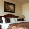 Отель Branson Yellow Rose Inn and Suites в Брэнсоне