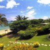 Отель Coconut Grove Beachfront Cottages, фото 14