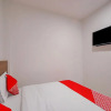 Отель OYO 90306 Mmtc2 Guest House, фото 15