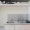 Отель Homey And Warm Studio Room At Taman Melati Margonda Apartment, фото 11